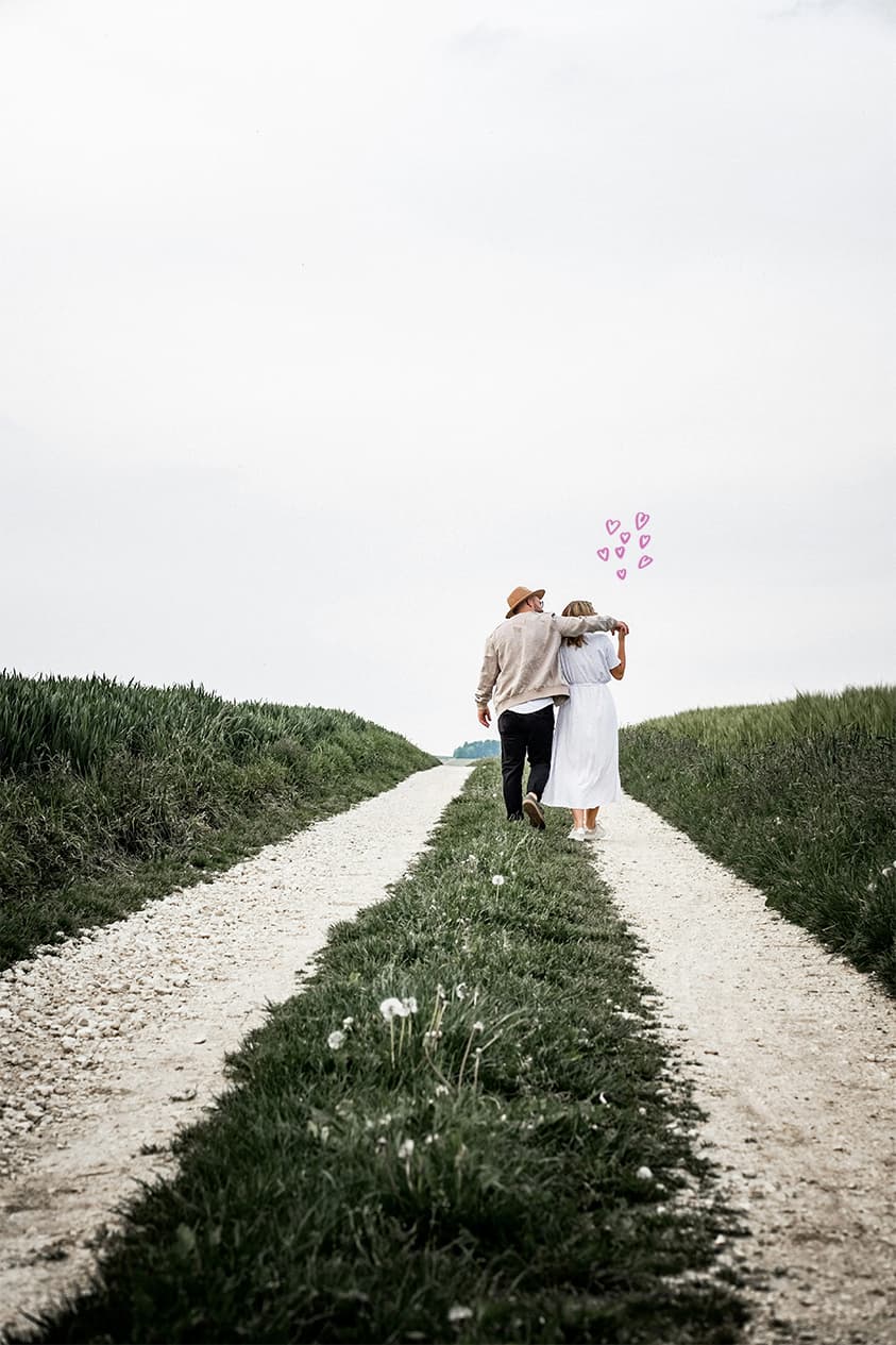 A couple in their forties walk together happily after learning how to successfully date through the support of a date coach
